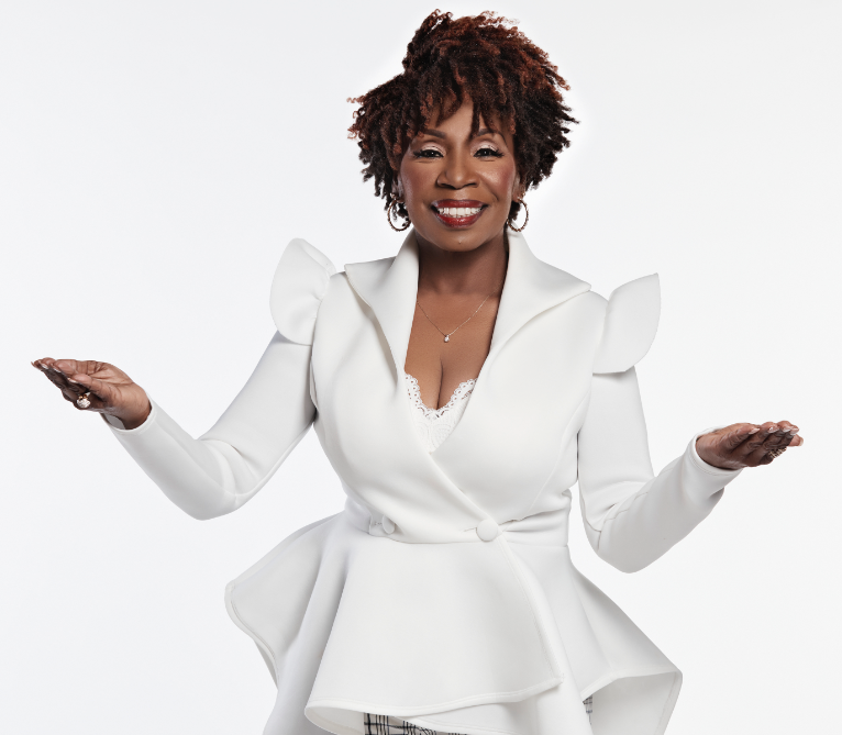 Iyanla Vanzant Iyanla Vanzant smiling with hands outstretched