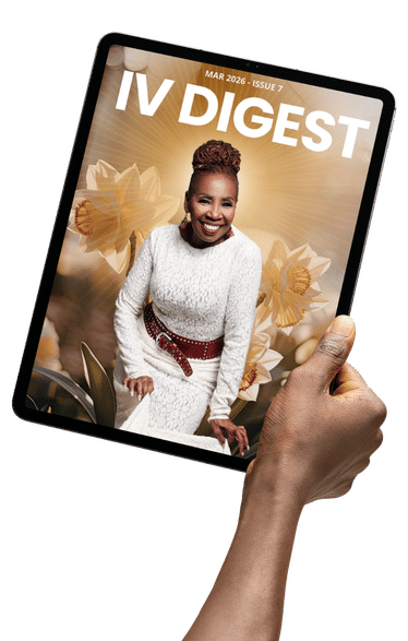 Hand holding IV Digest magazine cover on tablet